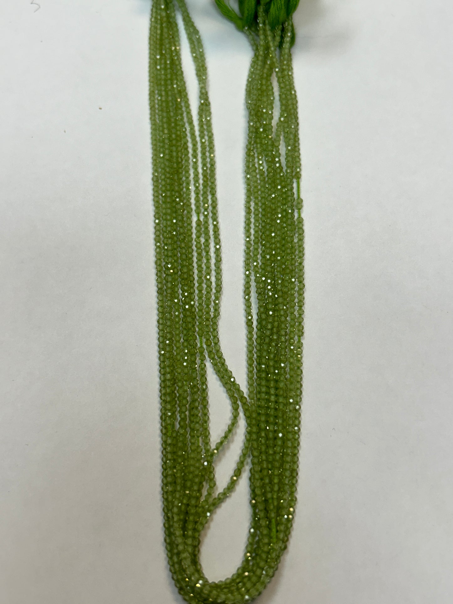 PERIDOT ROUND FACETED 2-3mm