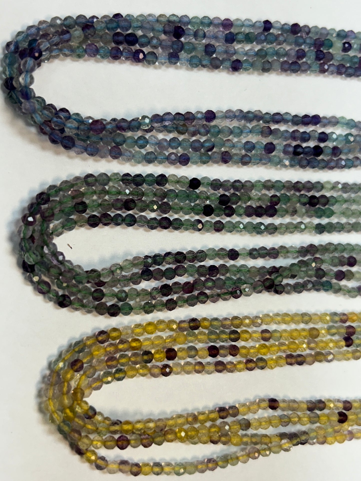 FLOURITE ROUND FACETED 3-4MM