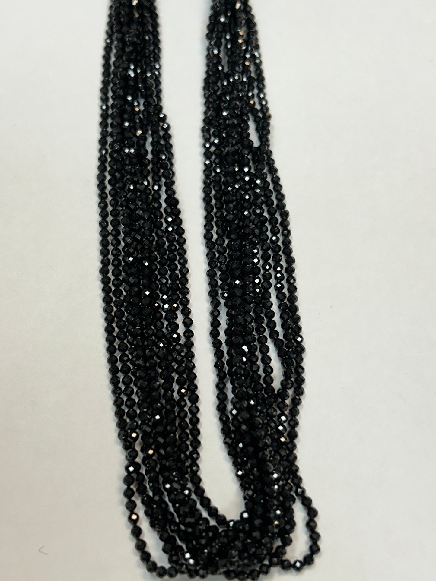 BLACK SPINEL ROUND FACETED 2-2.50 MM