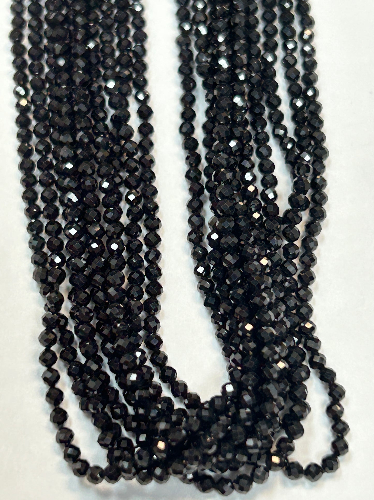 BLACK SPINEL ROUND FACETED 2-2.50 MM