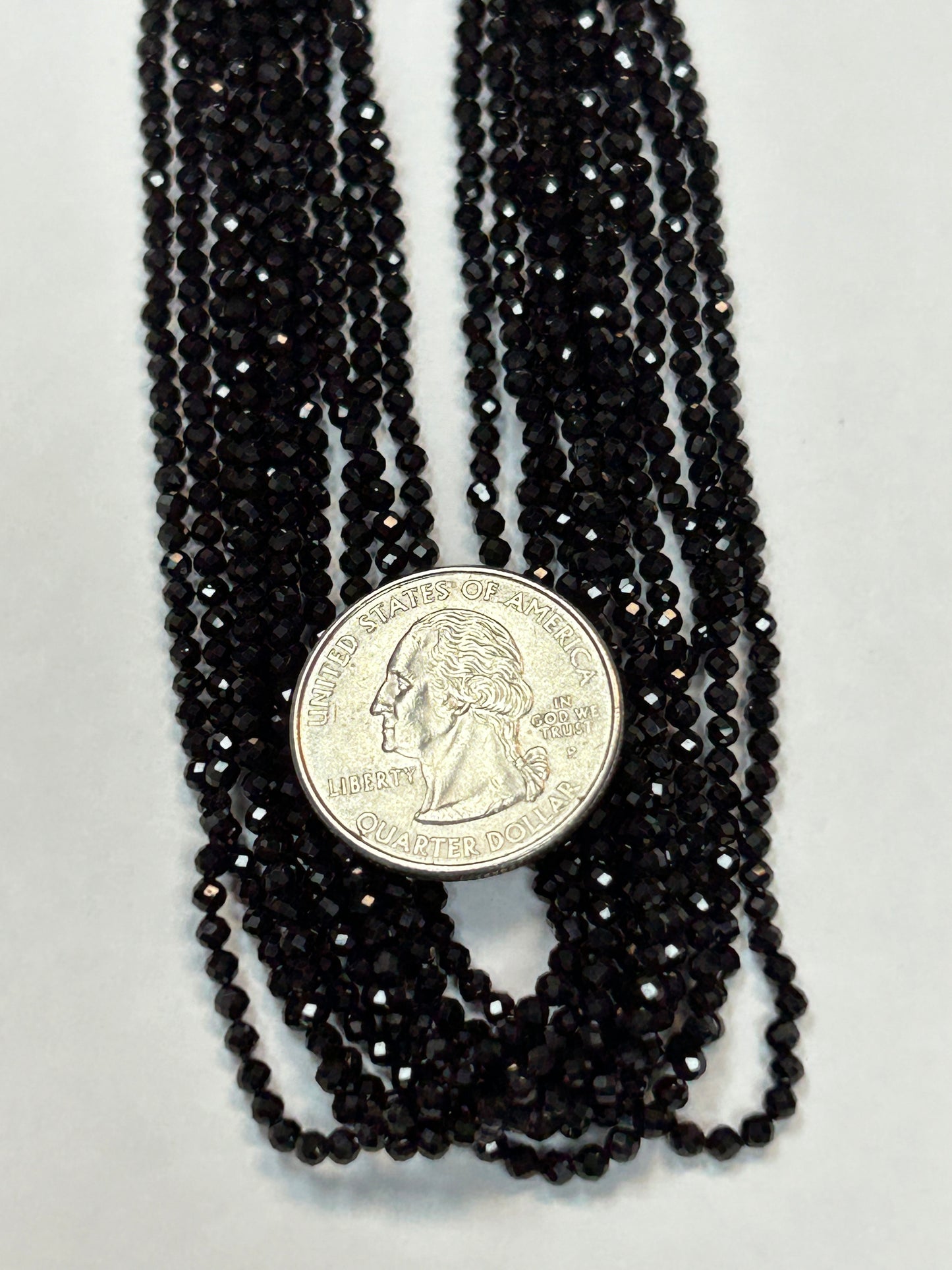 BLACK SPINEL ROUND FACETED 2-2.50 MM