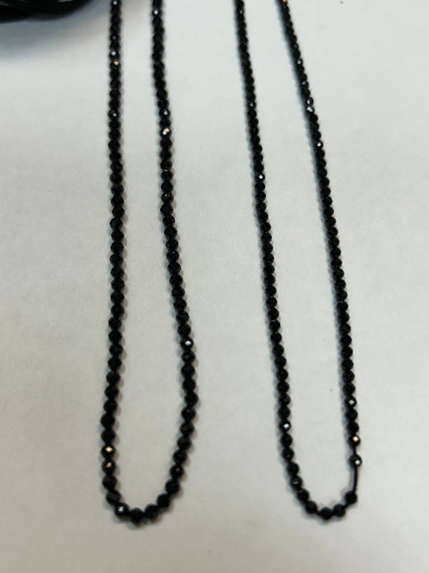 BLACK SPINEL ROUND FACETED 2-2.50 MM
