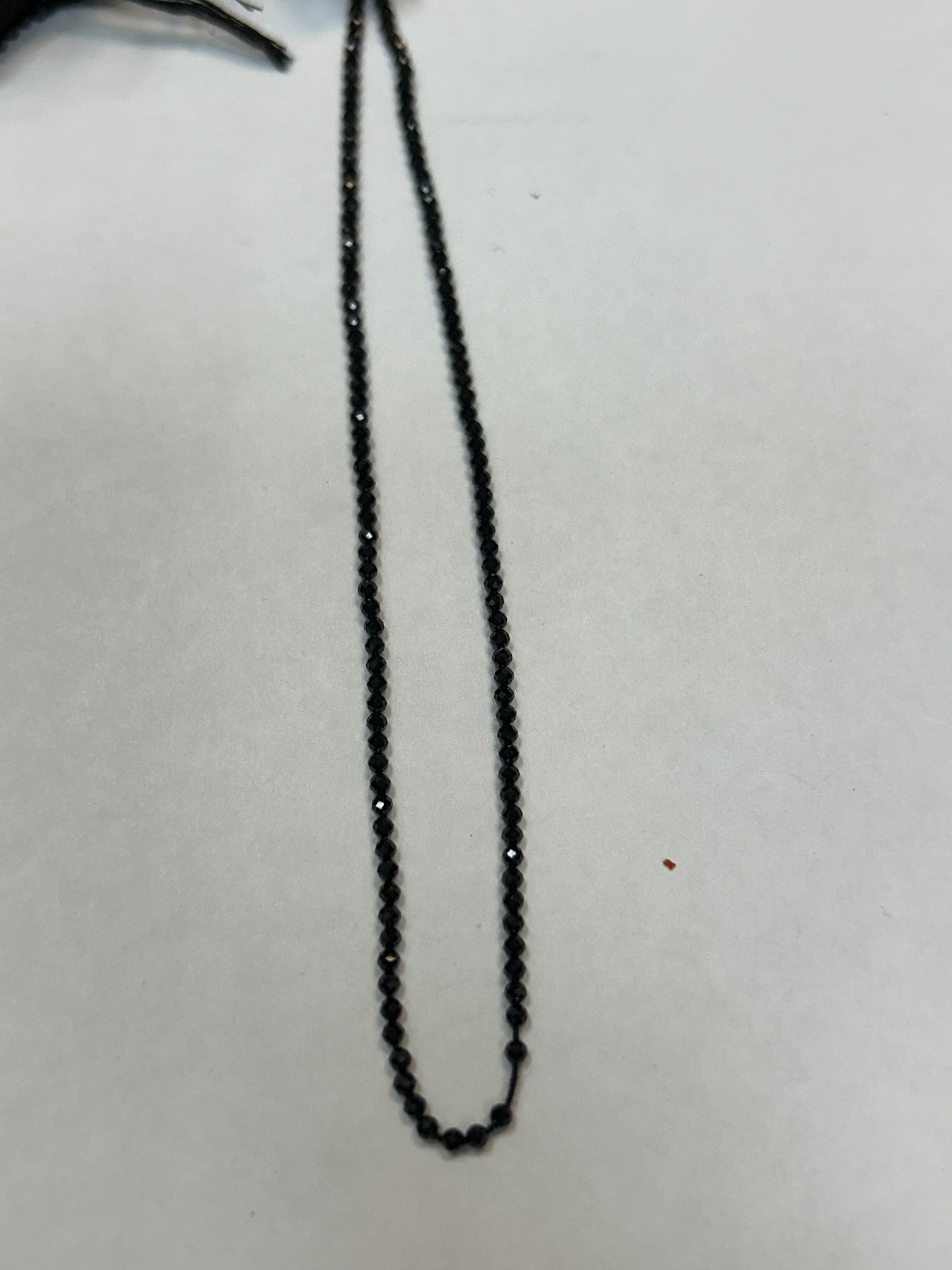 BLACK SPINEL ROUND FACETED 2-2.50 MM