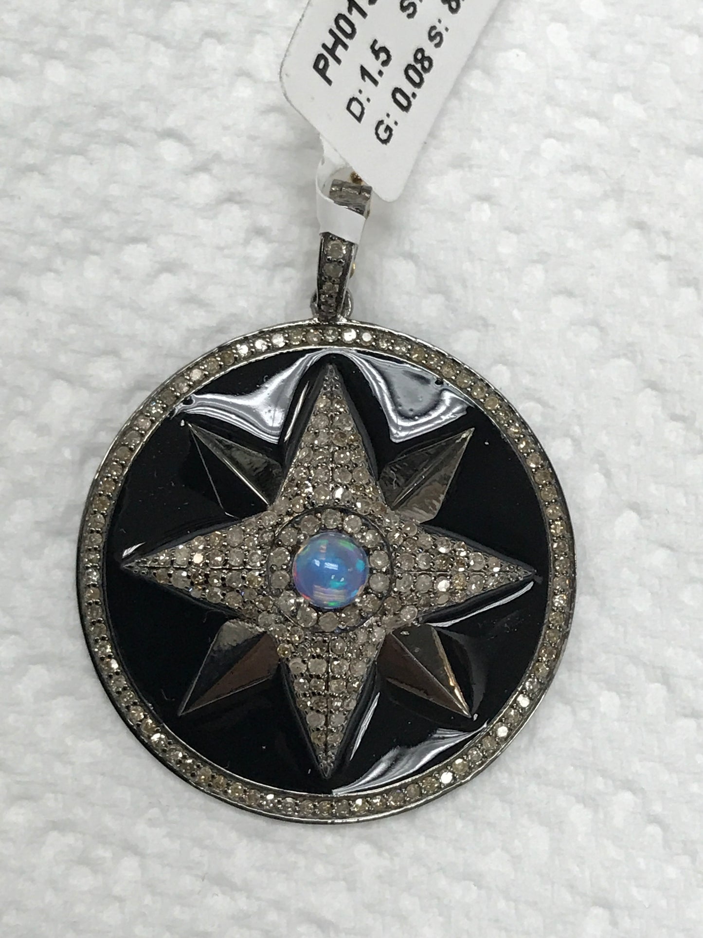 Circle with Star Burst in Black Paint and Embedded Stone Diamond Pendants & Charms