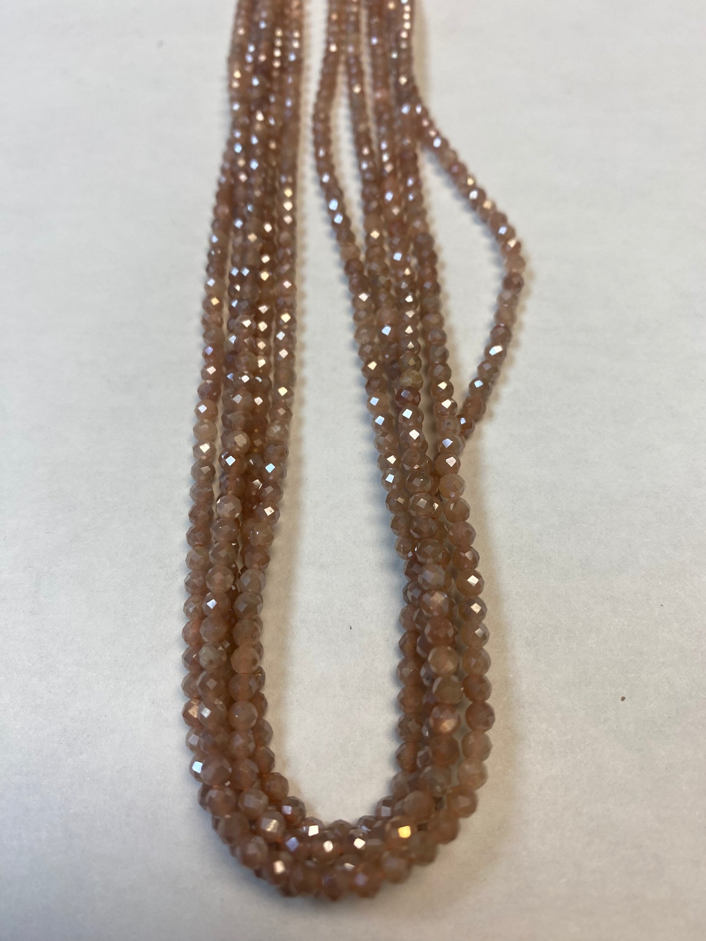 MOONSTONE COATED BEADS ROUND FACETED 3-4MM