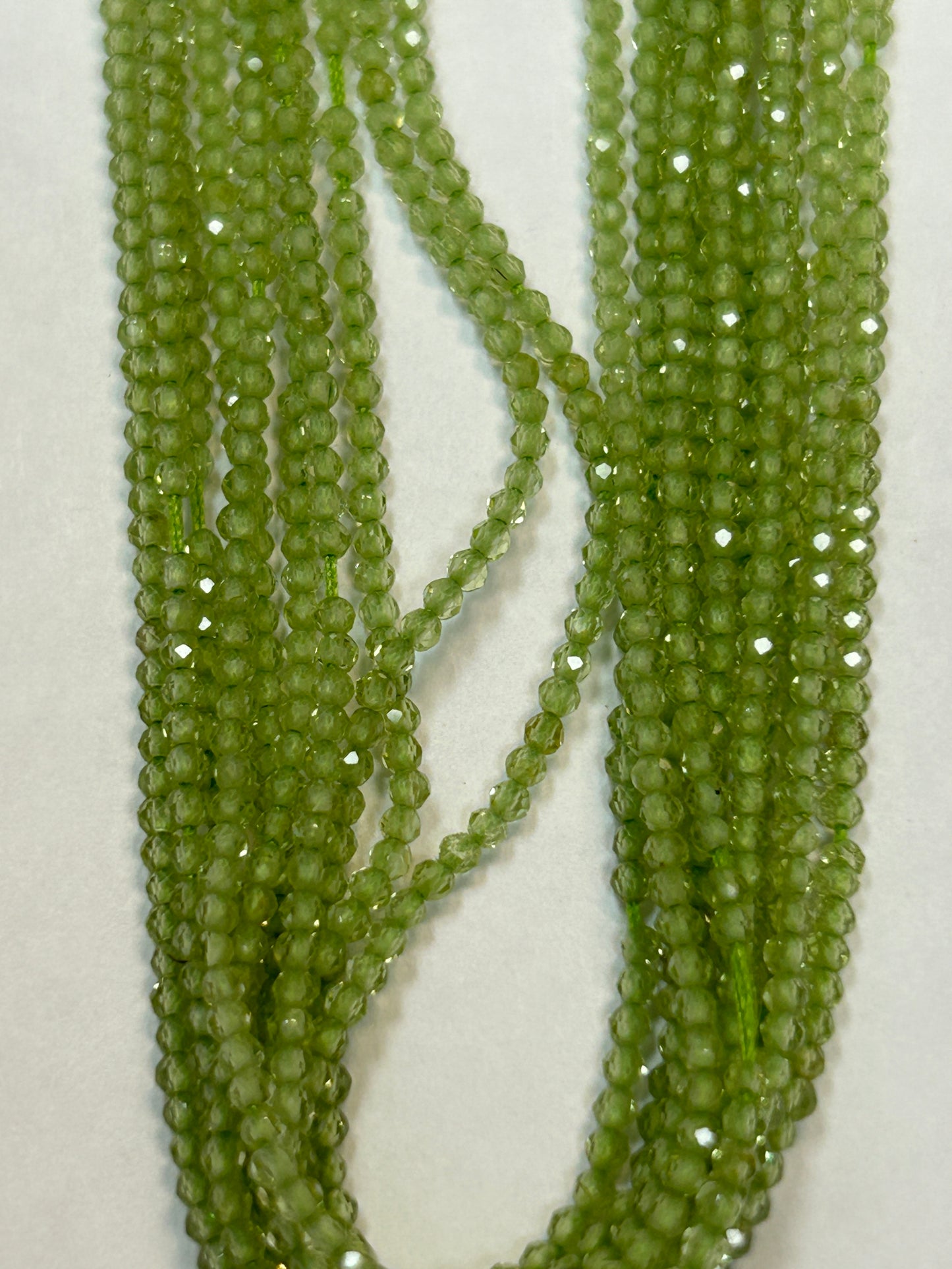 PERIDOT ROUND FACETED 2-3mm
