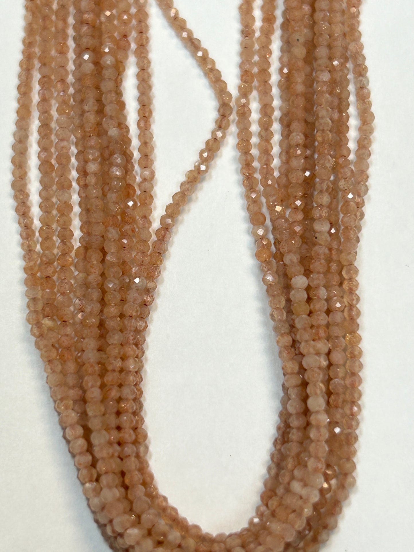 PEACH MOONSTONE ROUND FACETED 2-3mm