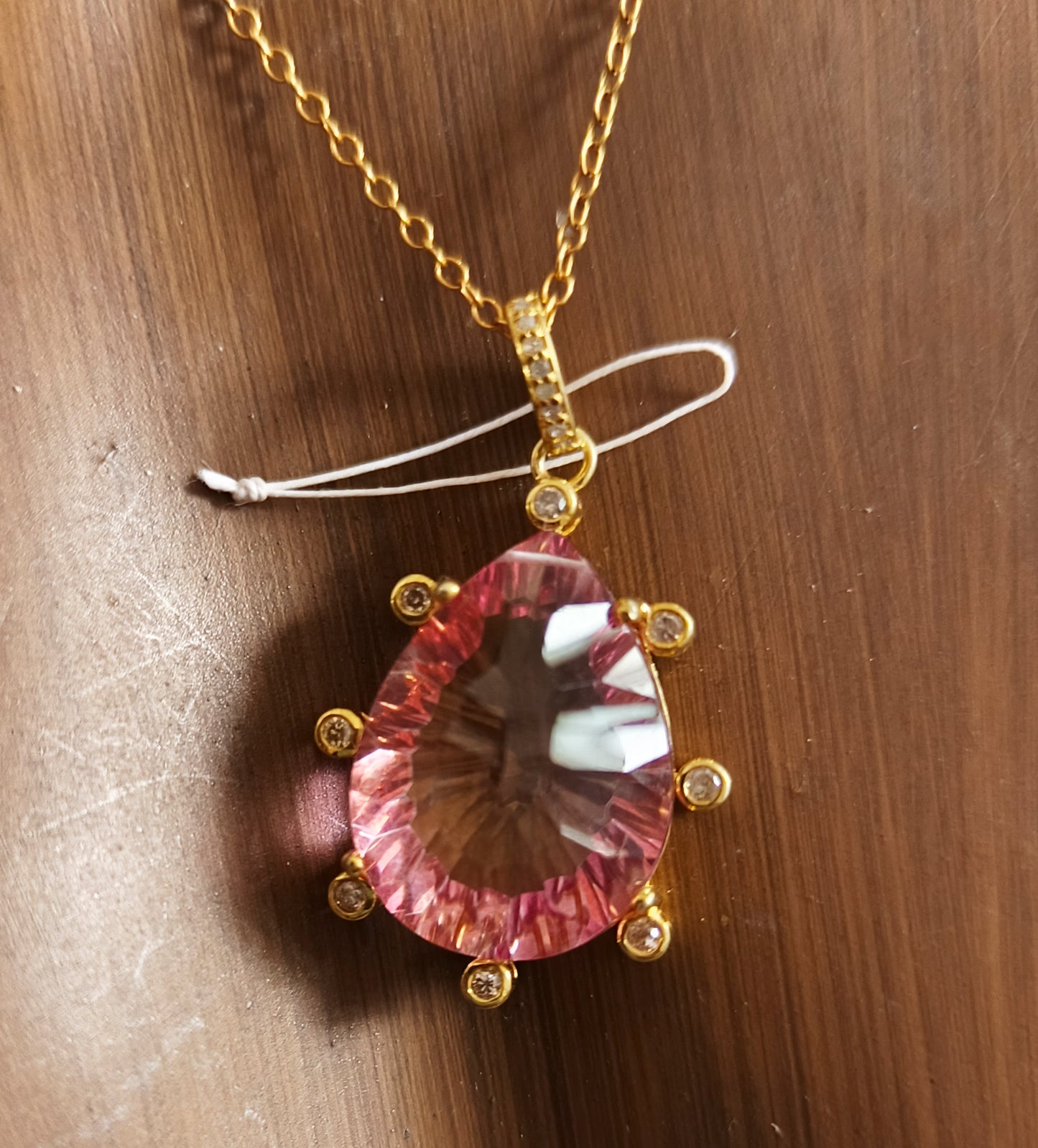 Gold pear-shaped mystic pink topaz pendant with diamond