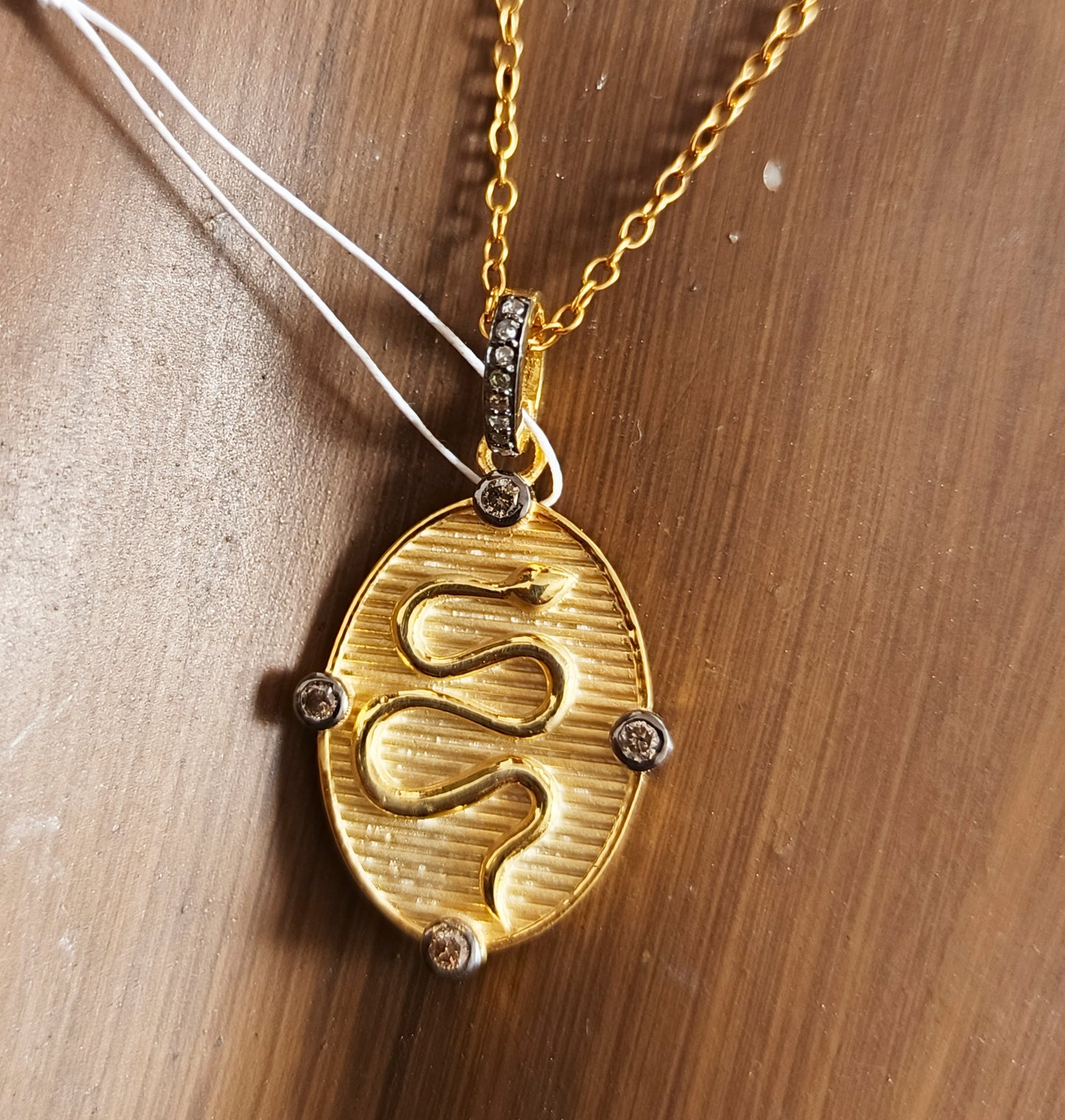 Oval Disk On Snake pendant in 925 silver with pave diamonds