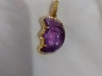Moon-shaped sterling silver pendant with Amethyst centerpiece and diamond border