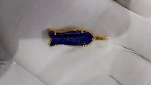 Fish-shaped sterling silver pendant with lapis lazuli centerpiece and pavé diamond border