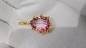 Gold pear-shaped mystic pink topaz pendant with diamond